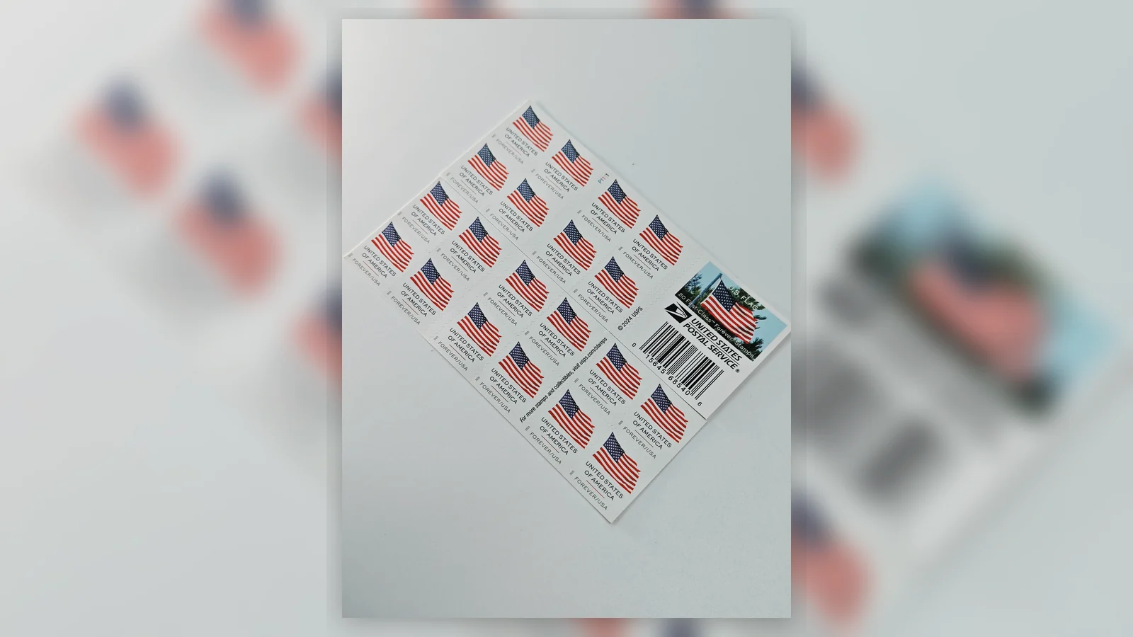 Real postage stamp designs arranged beside cards, invitations, and envelopes
